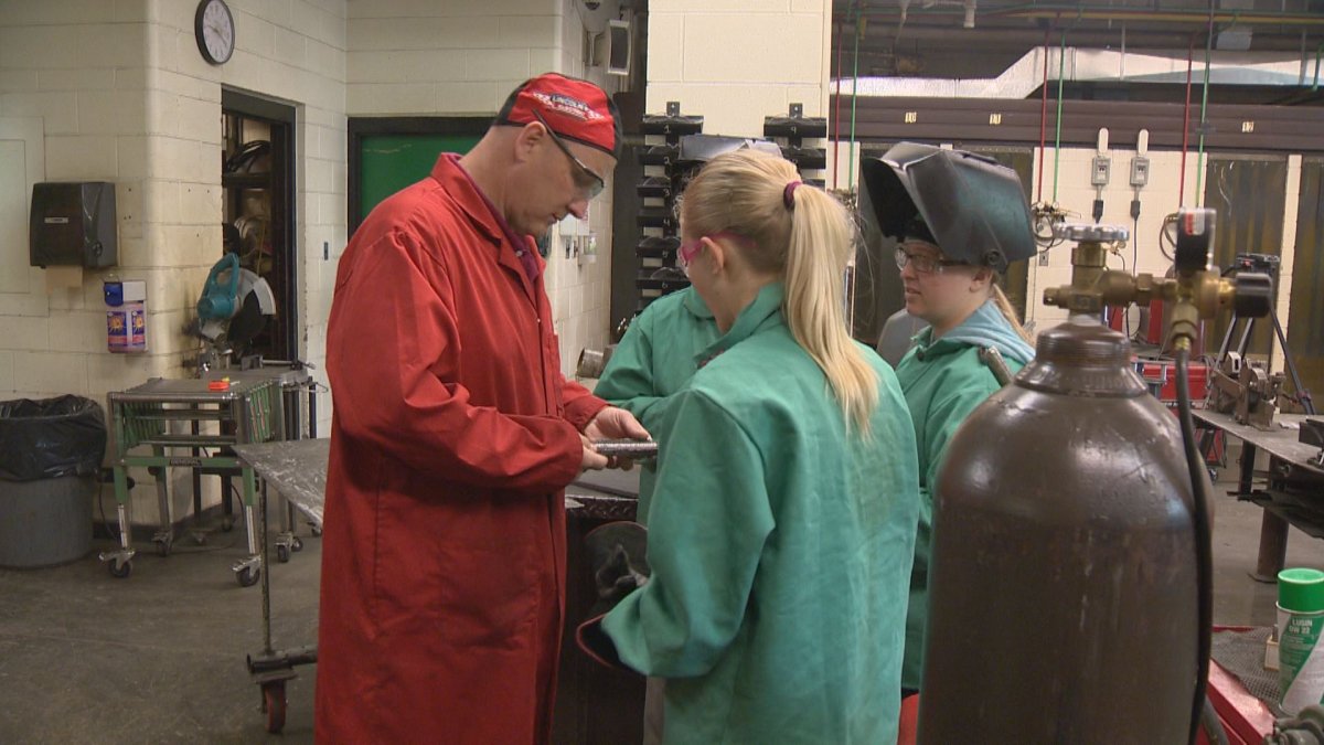 A dozen grade 10 students at Peacock Collegiate take part in an all-girls welding class.