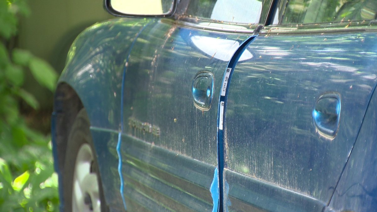 A car door in Wildwood Park is left ajar after being broken into Saturday night .