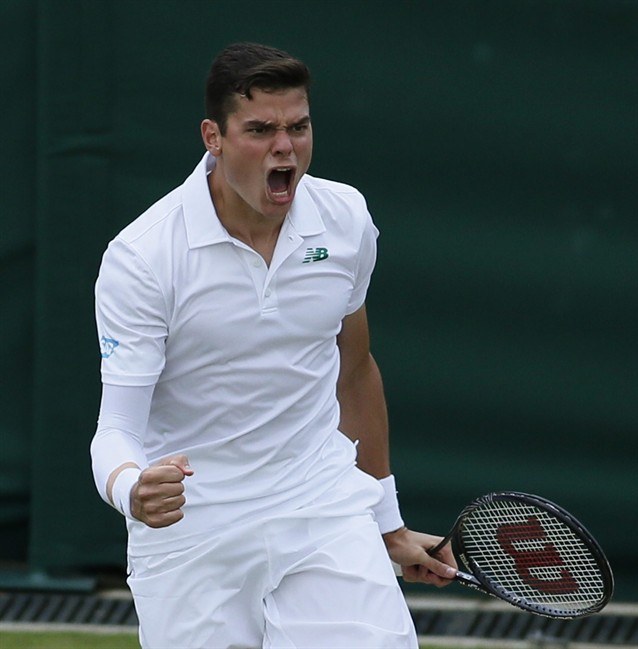 Milos Raonic of Canada celebrates after defeating Lukasz Kubot of Poland during their men's singles match at the All England Lawn Tennis Championships in Wimbledon, London, Saturday, June 28, 2014. (AP Photo/Alastair Grant).