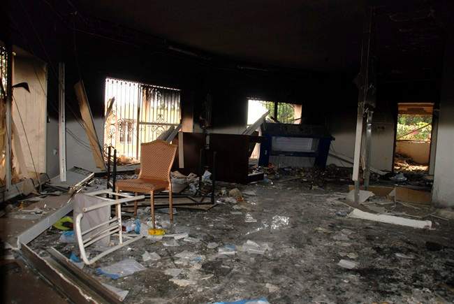 This Sept. 12, 2012 file photo shows glass, debris and overturned furniture are strewn inside a room in the gutted U.S. consulate in Benghazi, Libya, after an attack that killed four Americans, including Ambassador Chris Stevens. The capture of Ahmed Abu Khattala marks the first time the U.S has apprehended one of the accused perpetrators in the 2012 attack.