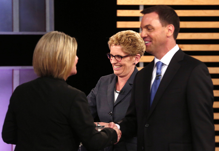 Ontario NDP leader Andrea Horwath, Ontario Premier Kathleen Wynne, centre, and Ontario Progressive Conservative leader Tim Hudak speak after taking part in the Ontario provincial leaders debate in Toronto, Tuesday June 3, 2014.