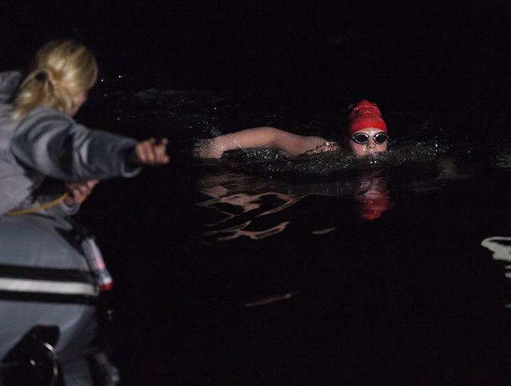 File: Annaleise Carr swims the final stretch of her record breaking Lake Ontario swim on August 19, 2012. On Saturday, July 26, she ended her Lake Erie crossing early after conferring with her support team.
