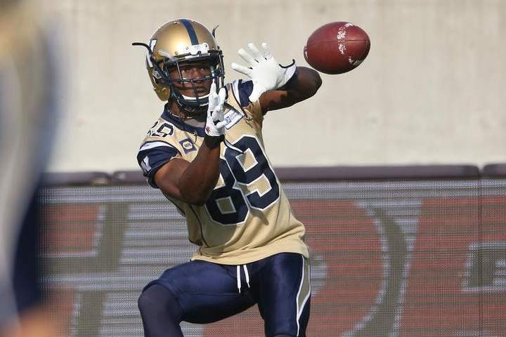 Clarence Denmark #89 of the Winnipeg Blue Bombers warms up before the start of CFL game action against the Hamilton Tiger-Cats on Thursday at Ron Joyce Stadium in Hamilton, Ont.
