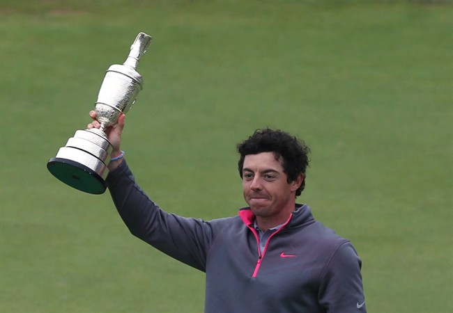 Rory McIlroy of Northern Ireland holds up the Claret Jug trophy after winning the British Open Golf championship at the Royal Liverpool golf club, Hoylake, England, Sunday July 20, 2014. (AP Photo/Jon Super).