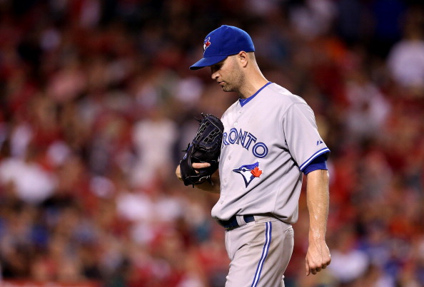 Starting pitcher J.A. Happ #48 of the Toronto Blue Jays walks to the dugout after being relieved in the fifth inning against the Los Angeles Angels of Anaheim at Angel Stadium of Anaheim on July 7, 2014 in Anaheim, California.  (Photo by Stephen Dunn/Getty Images).