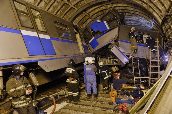Search and rescue teams of Ministry of Emergency Situations evacuate passengers injured after three subway cars derailed in Moscow,Russia on July 15, 2014. 