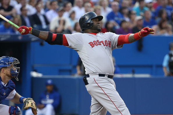 David Ortiz #34 of the Boston Red Sox hits a two-run home run in the fourth inning during MLB game action against the Toronto Blue Jays on July 21, 2014 at Rogers Centre in Toronto, Ontario, Canada. (Photo by Tom Szczerbowski/Getty Images).