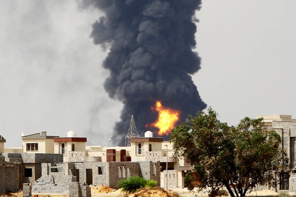 Flames and smoke billow from an oil depot where a huge blaze started following clashes around Tripoli airport in July 2014. Libya's foreign minister says the desire of extremist terrorist groups to reach oil resources and revenues is a dangerous matter.