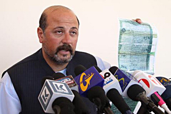 In this photograph taken on 21 February 2013, the cousin of outgoing Afghan President Hamid Karzai, Hashmat Karzai, speaks during a press conference in Kanadahar. A suicide attacker killed a cousin of outgoing Afghan President Hamid Karzai near the volatile southern city of Kandahar, officials said, raising tensions during a struggle over the contested election result. 