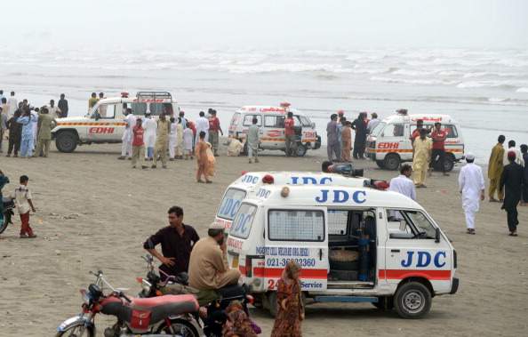Ambulances are pictured at the beachfront during ongoing recovery operations in search of missing bathers, feared drowned, at Clifton beach in Karachi on July 31, 2014. At least 19 bathers have drowned and four are missing in rough seas off Pakistan's biggest city Karachi, officials said, after defying a ban on swimming during the monsoon season.  The bathers were among thousands who had taken to the beaches to celebrate the Eid holiday, which began on Tuesday and continues until Friday.