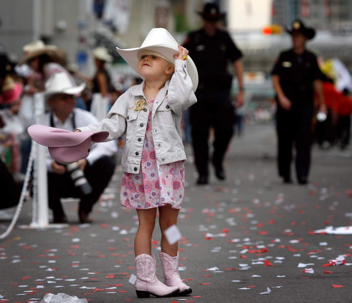 Kaija McLaughlan, four, couldn't decide which hat to wear on Friday, July 4, 2008. 