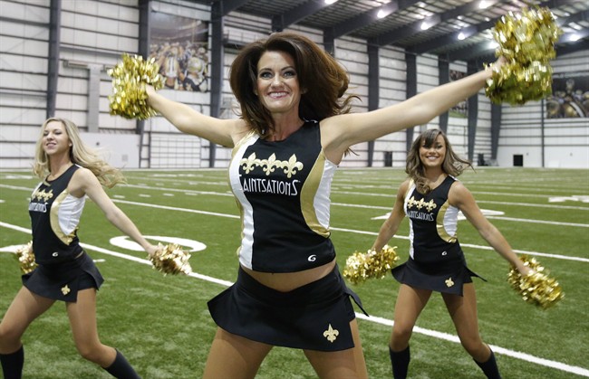 New Orleans Saints Saintsation Kriste Lewis performs during a photo shoot at the NFL football team's training facility in Metairie, La., Wednesday, July 16, 2014.