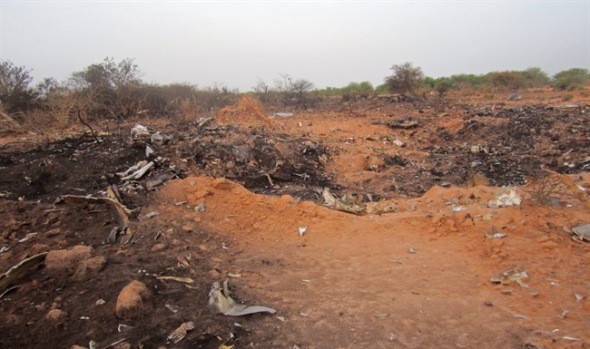 This photo provided on Friday, July 25, 2014, by the Burkina Faso Military shows the site of the plane crash in Mali. 