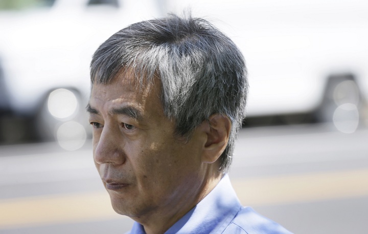 Former Iowa State University researcher Dong-Pyou Han leaves the rederal courthouse, Tuesday, July 1, 2014, in Des Moines, Iowa.