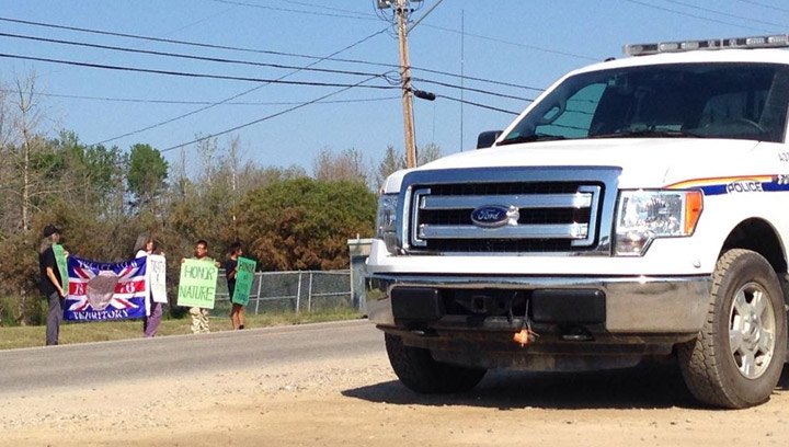 Protesters gather in Air Ronge, Sask. on July 30, 2014 to urge Prime Minister Stephen Harper to do more to fight native poverty and environmental degradation.