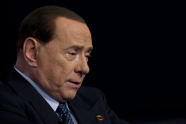 In this file photo taken in Rome on May 21, 2014, former Italian Premier and Forza Italia (Go Italy) party leader Silvio Berlusconi talks during the recording of a tv-talk show.  (AP Photo/Andrew Medichini).