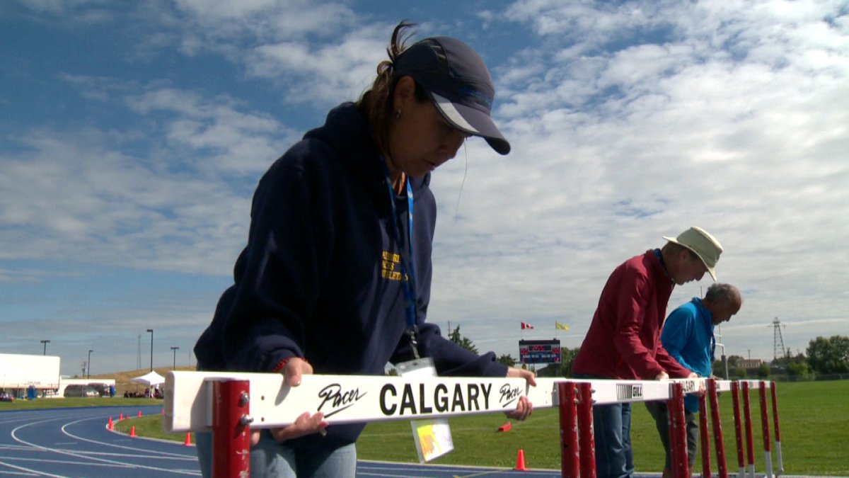 Volunteers help set up at the AB Summer Games.
