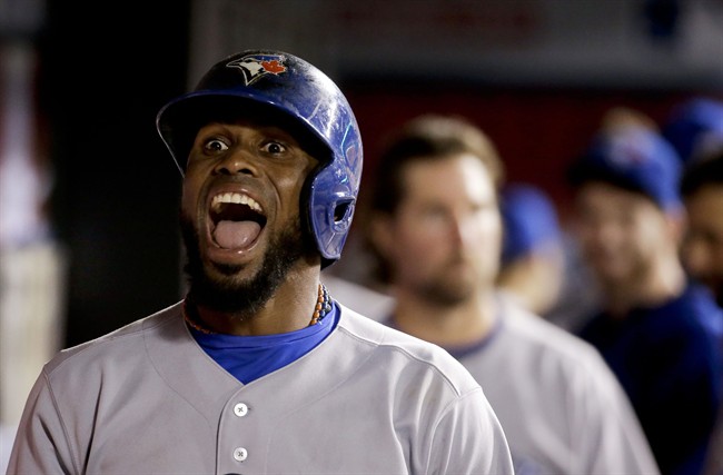 Toronto Blue Jays' Jose Reyes celebrates his two-run home run during the seventh inning of a baseball game against the Los Angeles Angels in Anaheim, Calif., Tuesday, July 8, 2014. (AP Photo/Chris Carlson).