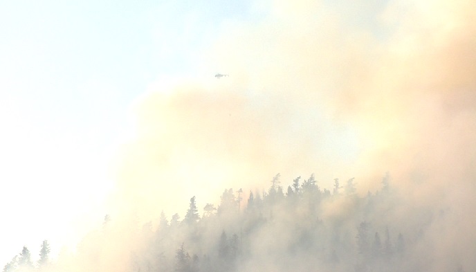 Forestry crews are fighting a wildfire on Apex Mountain.