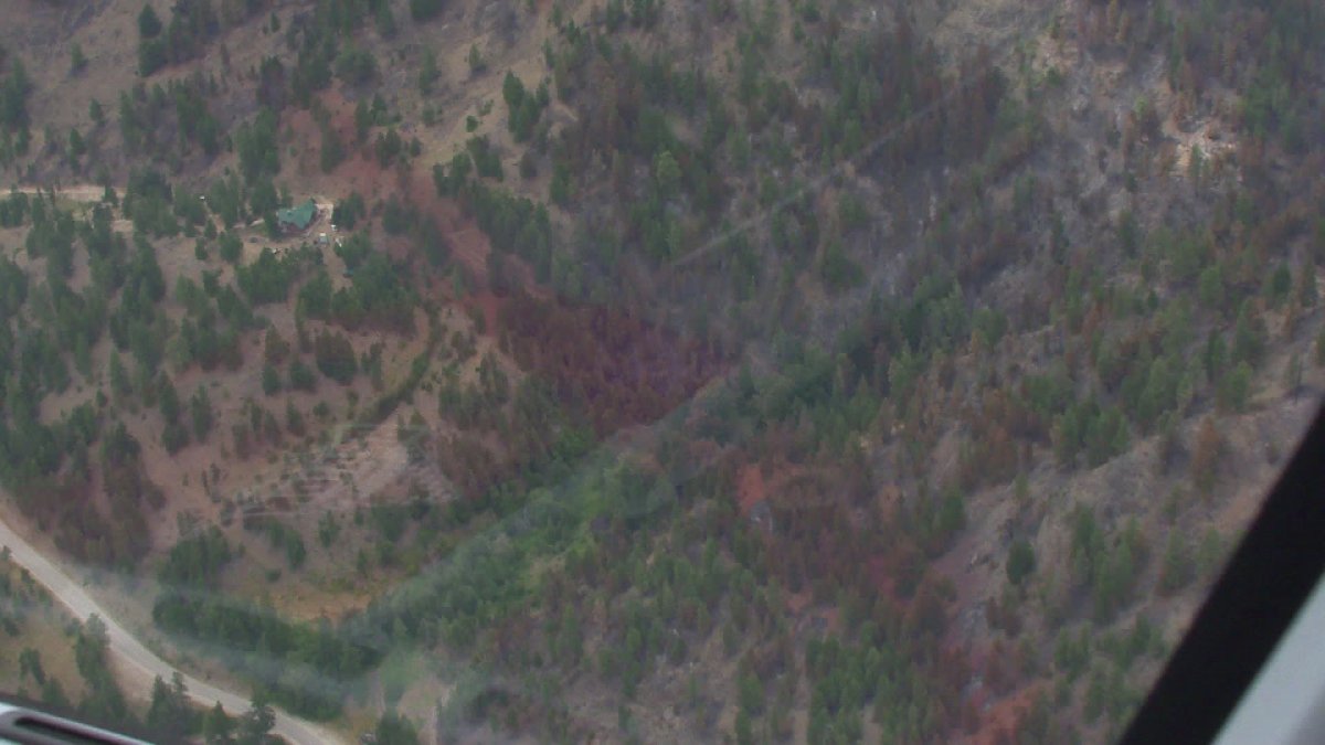 Fire and retardant lines seen from the air over the Apex Mountain wildfire .