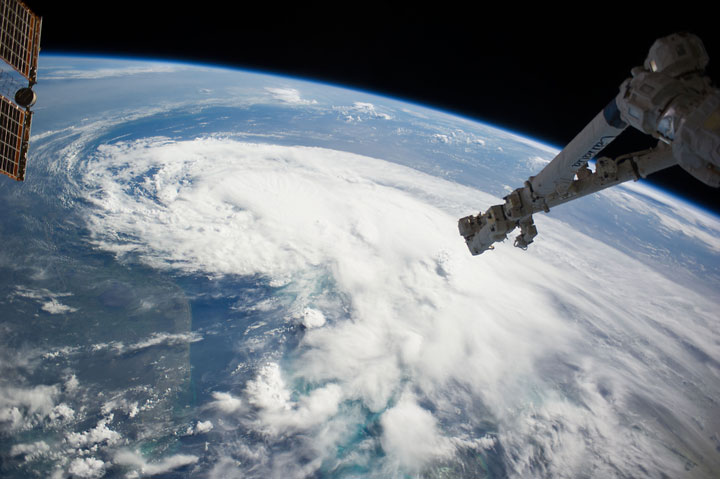 The Canadarm hangs over Tropical Storm Arthur early July 2, 2014.