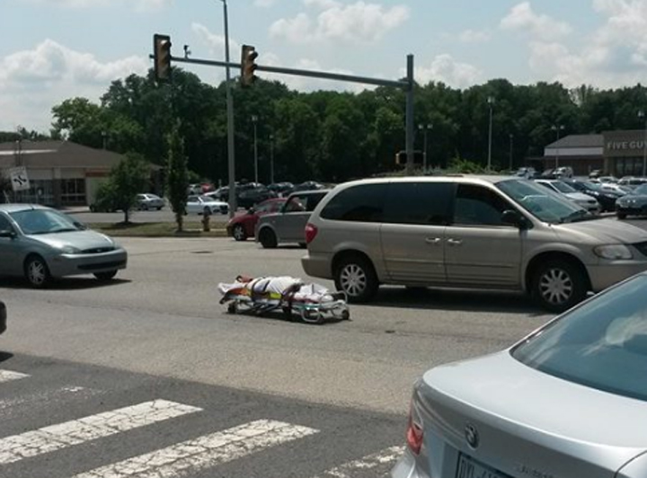 According to the Bucks County Courier Times, the incident happened near a busy shopping mall around noon, when a coroner's office employee noticed the rear door malfunctioned and opened while transporting the body.
