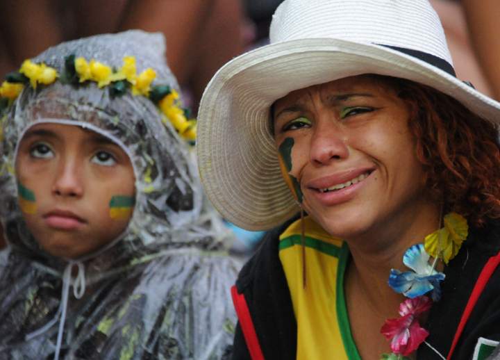 Fans of Brazil at the FIFA Fan Fest in Rio de Janeiro, gesture during the Brazil 2014 FIFA World Cup semifinal match Brazil vs Germany.