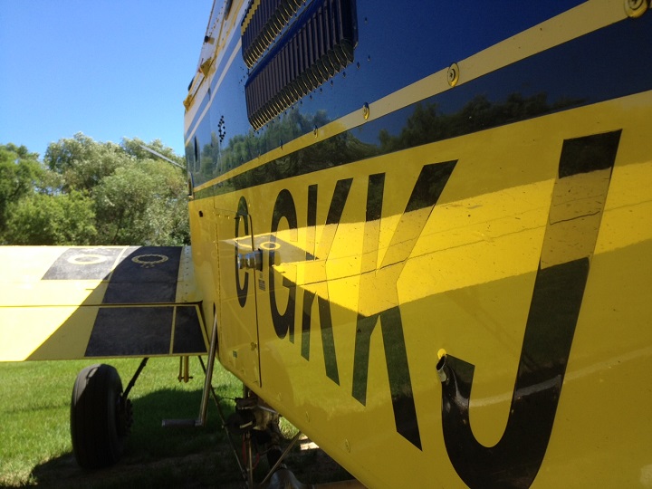 Crop spraying aircraft showing exit hole from bullet in the lower right of the picture obtained by Global News on Friday, July 11, 2014.