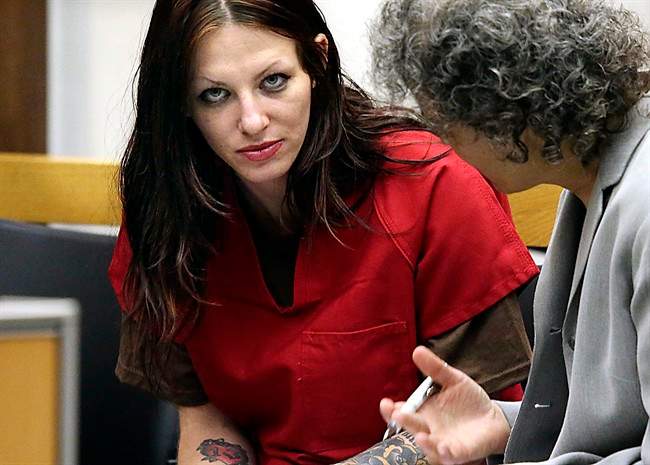 Alix Tichelman confers with her lawyer during her arraignment in Santa Cruz Superior Court, July 9, 2014, in Santa Cruz, Calif.
