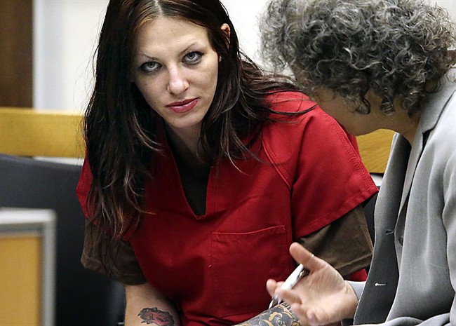 Alix Tichelman confers with her lawyer during her arraignment in Santa Cruz Superior Court, July 9, 2014, in Santa Cruz, Calif.