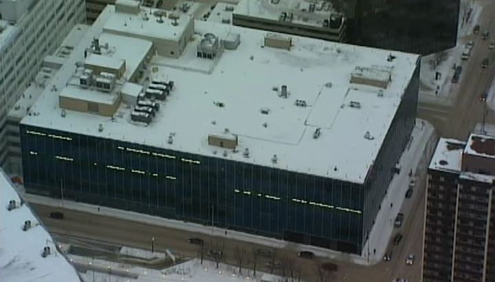 An off-duty cop was stabbed in December in the staff parking lot outside police headquarters.