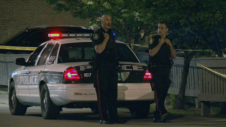 Winnipeg police at the scene of a shooting at Graham Avenue and Carlton Street in 2014.