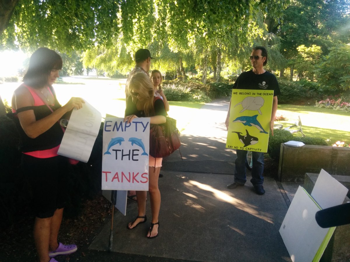 Members of the public gather outside park board meeting on whether to keep whales at the Vancouver Aquarium. 