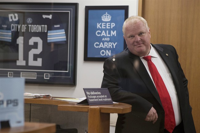 Toronto Mayor Rob Ford waits for an elevator before leaving his office at city hall to take part in a vote on Wednesday July 9, 2014.