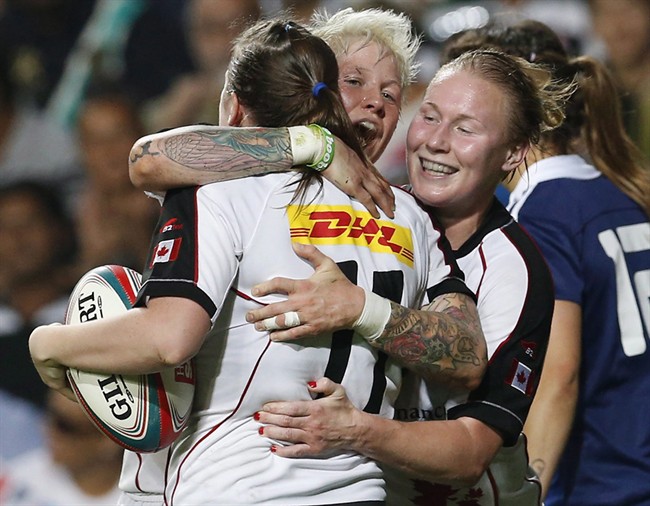 Mandy Marchak (right) celebrates with teammates after defeating France during the final match of Women's Invitational Cup at the Hong Kong Sevens rugby tournament in Hong Kong on March 28. 