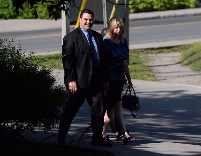 MP Dean Del Mastro arrives at court with wife Kelly in Peterborough, Ont., on June 23, 2014. 