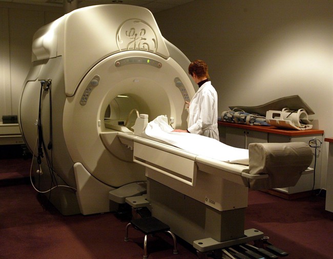 A technician operates an MRI machine at a private clinic in Calgary on Jan. 12, 2005. 