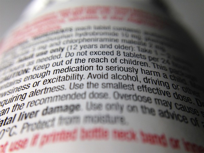 Instructions on an over-the-counter pill bottle are shown in Toronto on Monday, July 7, 2014.