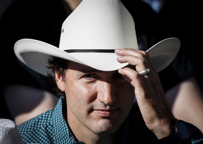 Liberal leader Justin Trudeau attends the Calgary Stampede parade, Friday, July 4, 2014. If you thought you've seen that snippet of "in over his head" Liberal Leader Justin Trudeau stripping off his shirt a zillion times, just wait ??? the political advertising season is about to explode. THE CANADIAN PRESS/Jeff McIntosh.