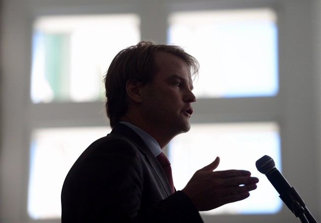 Immigration Minister Chris Alexander speaks during an event in Ottawa on June 20, 2014.