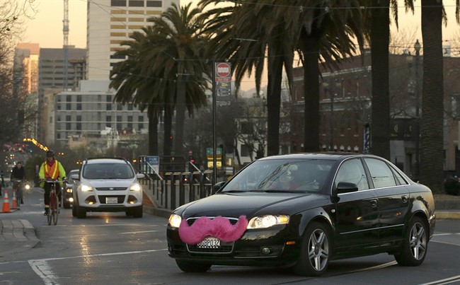 A Lyft car crosses Market Street in San Francisco.