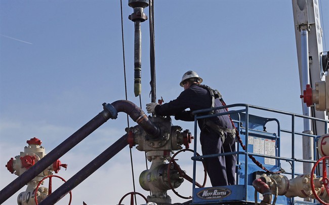 Perforating tools, used to create fractures in the rock, are lowered into one of six wells during a roughly two-week hydraulic fracturing operation at an Encana Corp. well pad near Mead, Colo. on March 25, 2014.