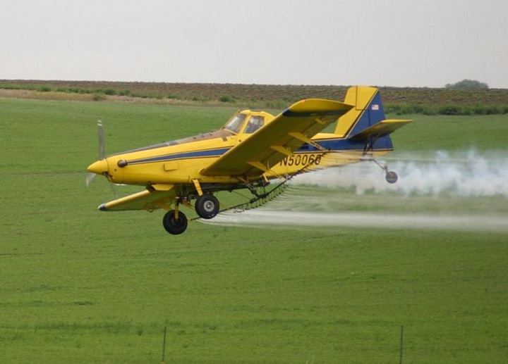A file image shows a crop-dusting aircraft.