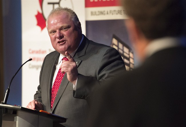 Mayor Rob Ford debates with fellow mayoral candidate John Tory during a mayoral debate in Toronto on Tuesday, July 15, 2014.
