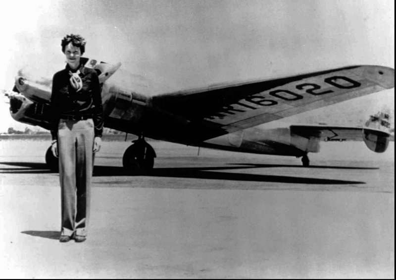 In this undated file photo, Amelia Earhart stands next to a Lockheed Electra 10E, before her last flight in 1937 from Oakland, Calif., bound for Honolulu on the first leg of her record-setting attempt to circumnavigate the world westward along the Equator.