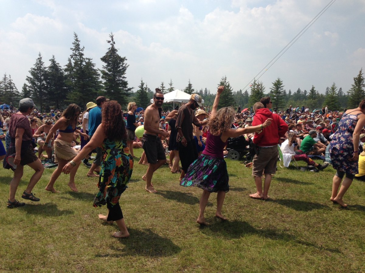 People dance to music at Folk Festival .