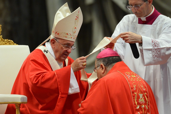 New archbishop of Reggio Calabria-Bova (Italy) Giuseppe Fiorini Morosini receives the Pallium from Pope Francis during a mass for the new metropolitan archbishops and the solemnity of Saints Peter and Paul on June 29, 2014 at St Peter's basilica in Vatican.  