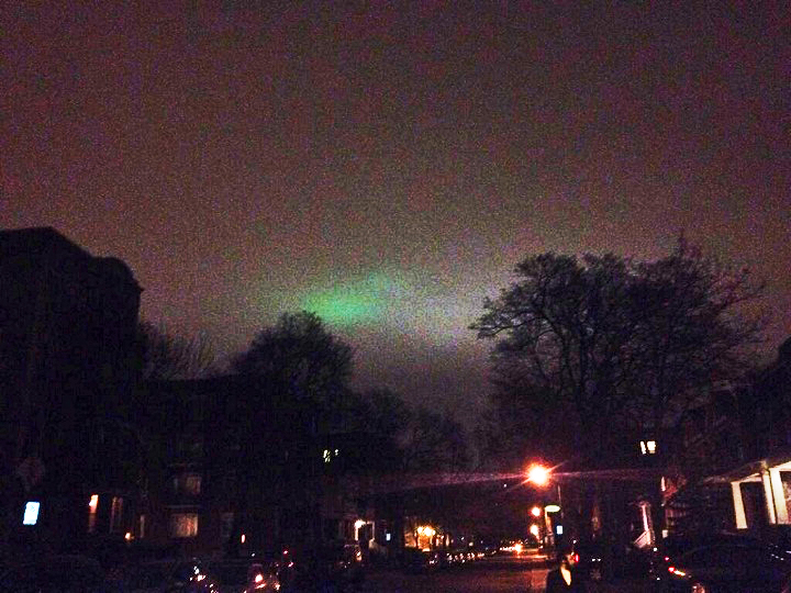 A glimpse of the green light that appears some nights in the sky above Montreal.