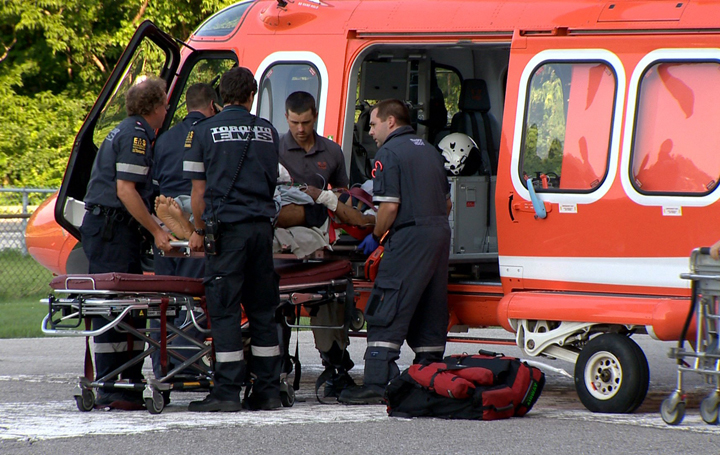 A man is loaded onto an air ambulance after a crash in Halton Hills July 14, 2014.