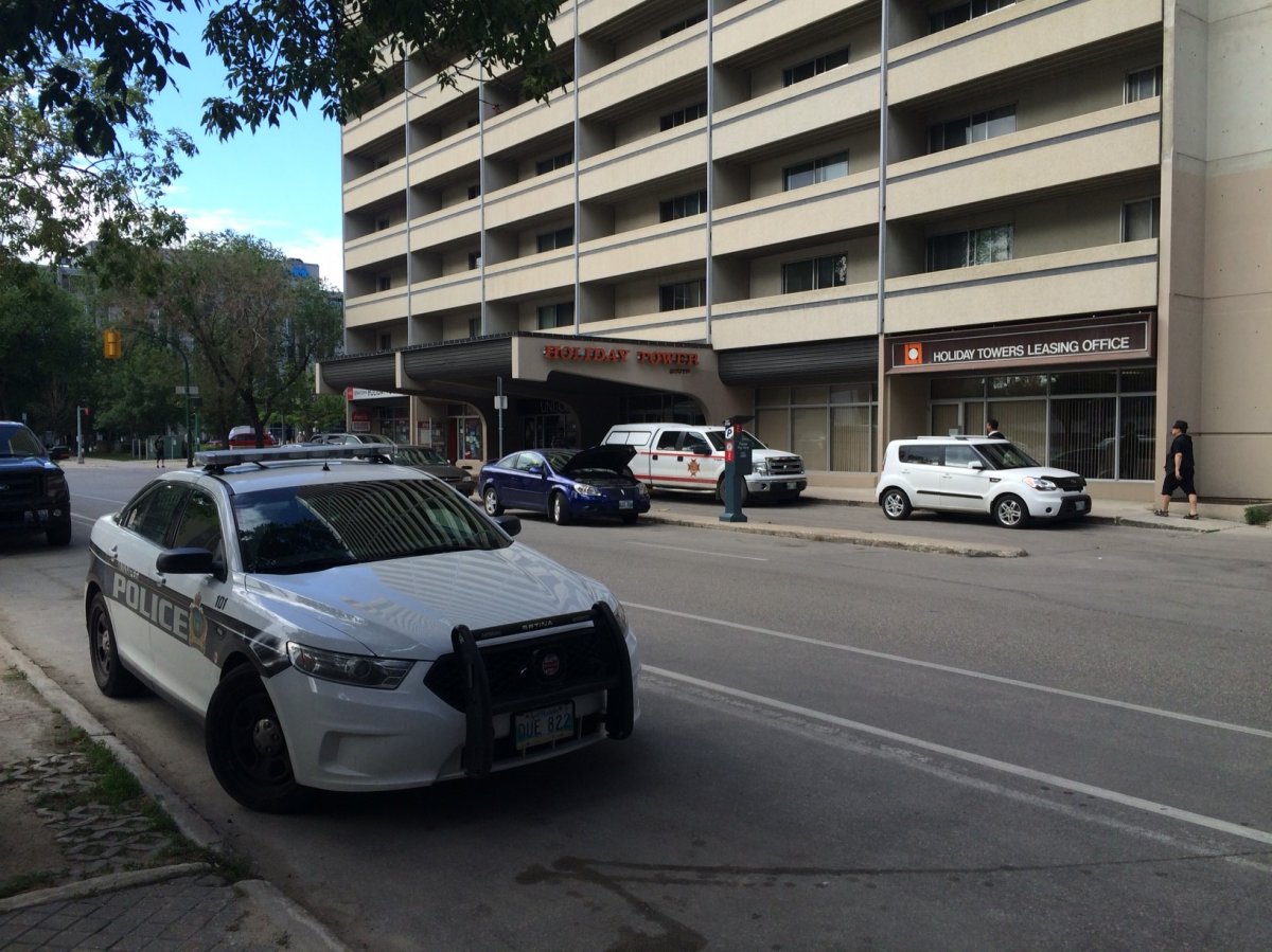 Police say a man found at the scene of a fire at the Holiday Towers was killed.